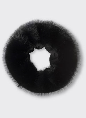 A plush black fur scrunchie by MEOTINE, perfect for adding a stylish touch to any hairstyle. Soft and luxurious design.