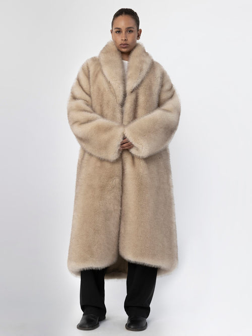 Luxurious beige faux fur coat by MEOTINE, featuring a wide collar and oversized fit, perfect for stylish winter warmth.