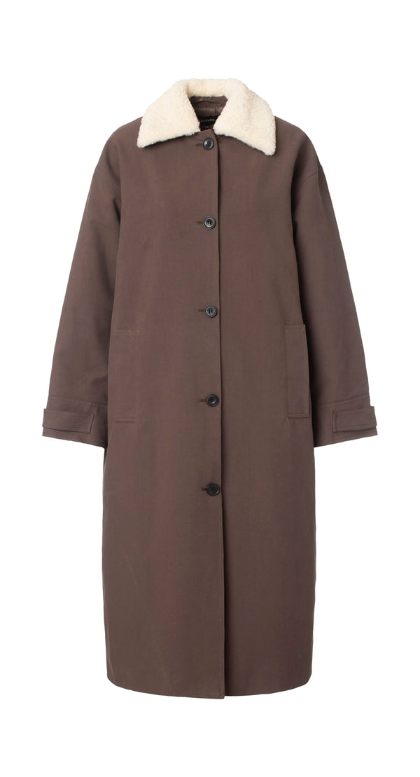 Brown long coat with a soft white collar and button closure, featuring side pockets. Perfect for stylish warmth by MEOTINE.