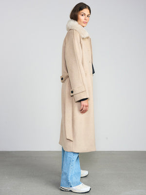 A model showcases a stylish beige coat with a fur collar, paired with light blue jeans and sneakers, representing MEOTINE's chic aesthetic.