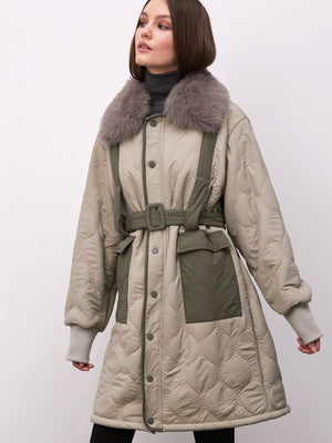Stylish quilted coat with a fur collar, featuring a belted waist and pockets, perfect for a chic winter look by MEOTINE.