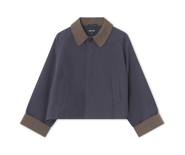 Stylish cropped jacket in navy with a contrasting brown collar and cuffs, perfect for a modern look. By MEOTINE.